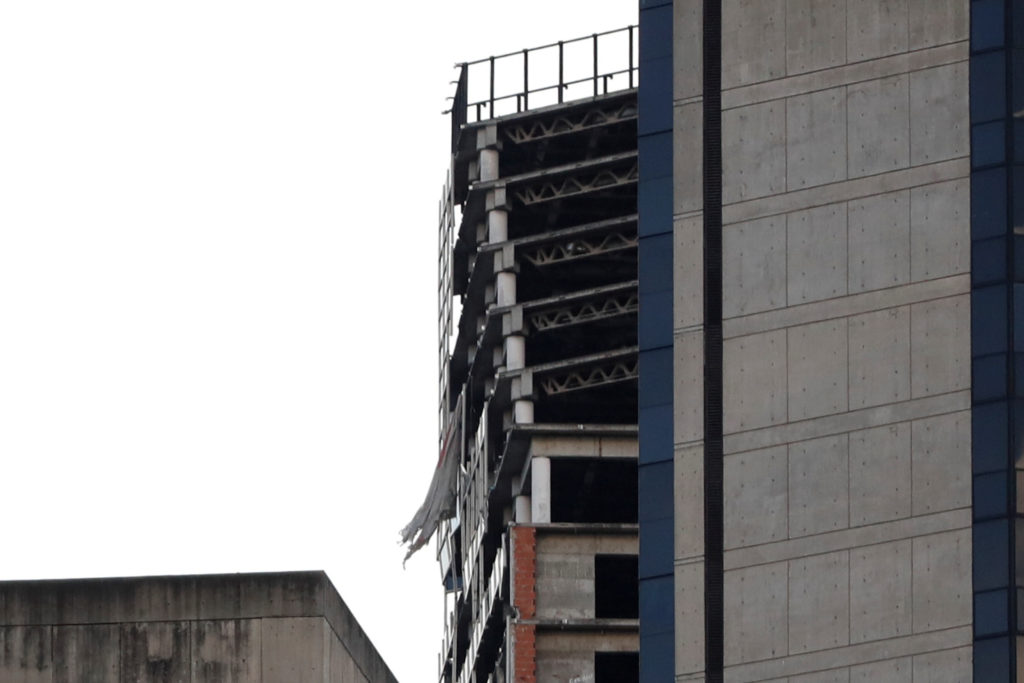 Structural damages from an earthquake are seen on the top five floors of an abandoned skyscraper in Caracas, Venezuela on ...