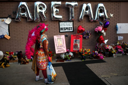 A woman stands by a makeshift memorial outside the New Bethel Baptist Church during a gospel tribute concert for the late singer Aretha Franklin in Detroit, Michigan, U.S., August 27, 2018. REUTERS/Mike Segar - RC1E4E40DAE0