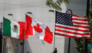 Flags of the U.S., Canada and Mexico fly next to each other in Detroit, Michigan, U.S. August 29, 2018. REUTERS/Rebecca Cook