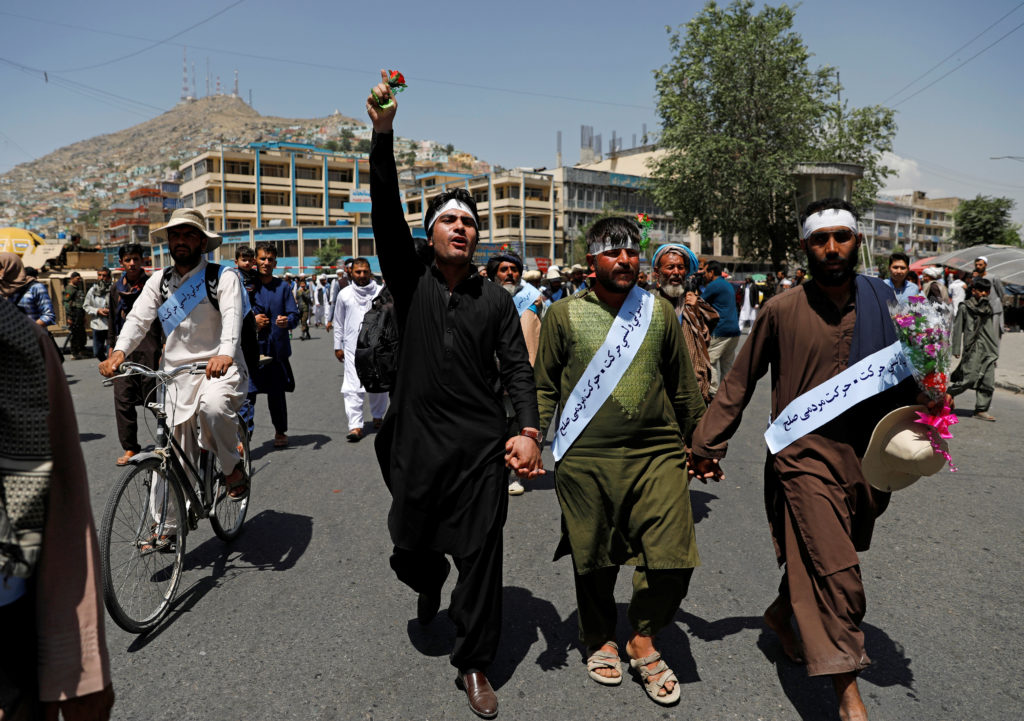 Members of the Taliban, soldiers and civilians mingled on the streets of Kabul, Afghanistan during the temporary cease-fir...