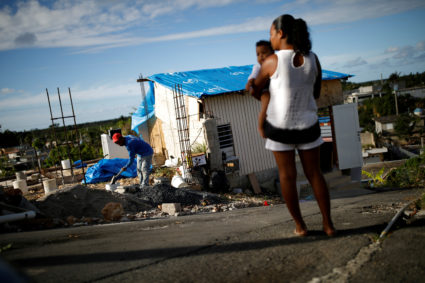 Residents work to rebuild their houses damaged by Hurricane Maria in Canovanas, Puerto Rico. File photo by Carlos Garcia Rawlins/Reuters