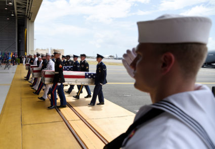 Caskets containing the remains of American servicemen from the Korean War handed over by North Korea arrive at Joint Base Pearl Harbor-Hickam in Honolulu, Hawaii, on Aug. 1. Photo by Hugh Gentry/Reuters
