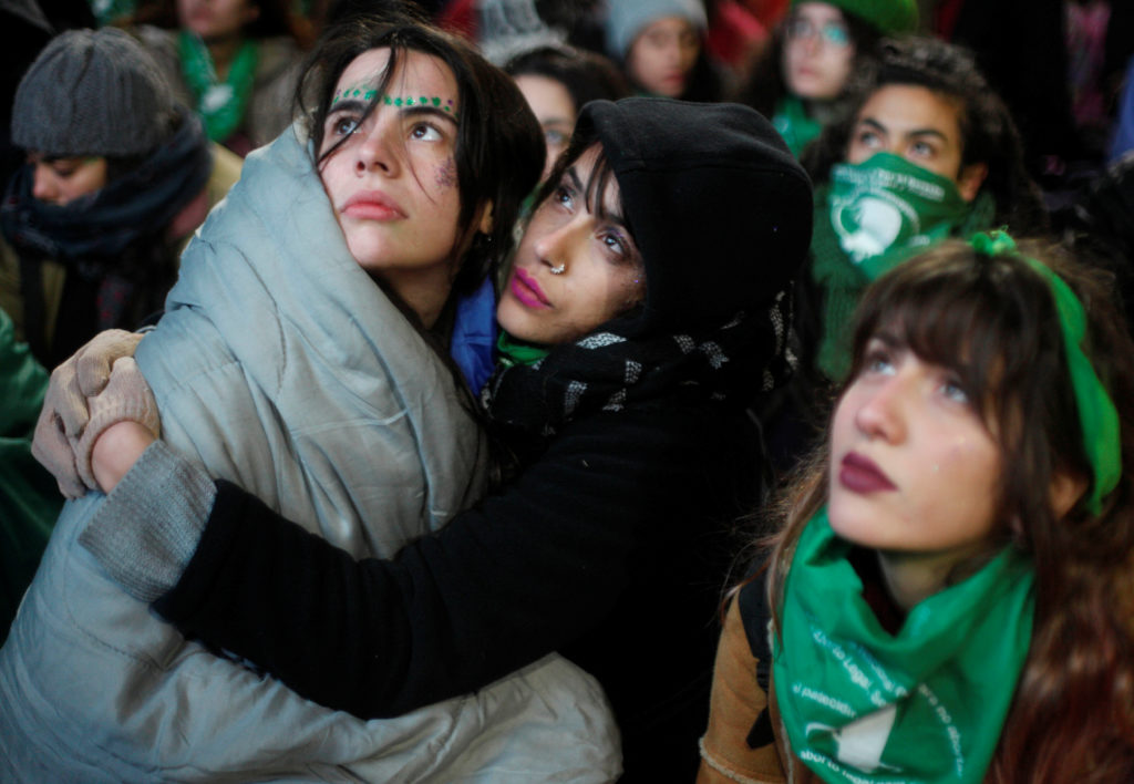 Demonstrators attend a protest in favour of legalising abortion outside the Congress while lawmakers debate an abortion bi...