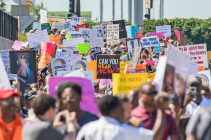 Thousands of activists shut down the Dan Ryan Expressway lead by Rev. Michael Pfleger from Saint Sabina Catholic Church to protest gun violence on July 7, 2018, in Chicago, IL. (Photo by Patrick Gorski/NurPhoto via Getty Images)