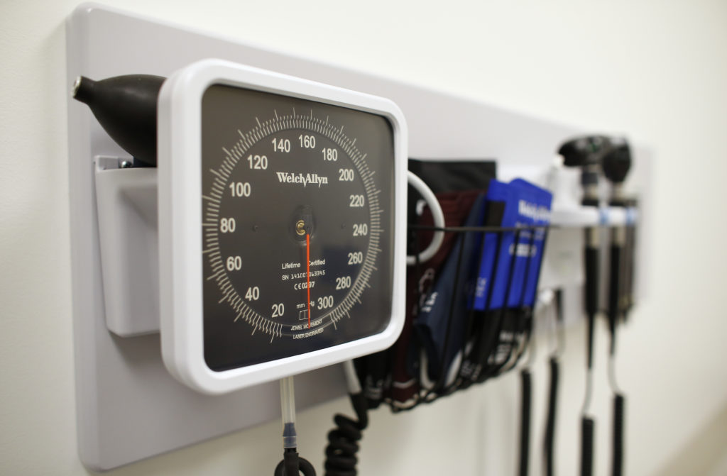 Medical equipment is pictured on the wall of an examination room inside a Kaiser Permanente health clinic located inside a...