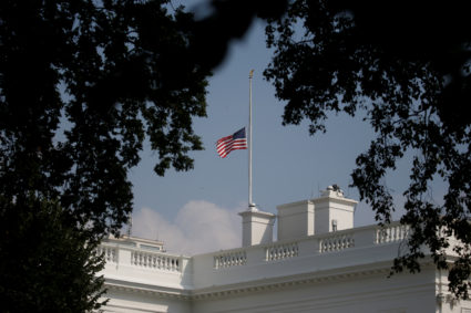 The White House flag is seen after being returned to half-staff in honor of Senator John McCain (R-AZ) after first being lowered on Sunday in his honor, then raised again just after midnight on Monday and then being returned to half-staff Monday afternoon at the White House in Washington, U.S., August 27, 2018. REUTERS/Leah Millis