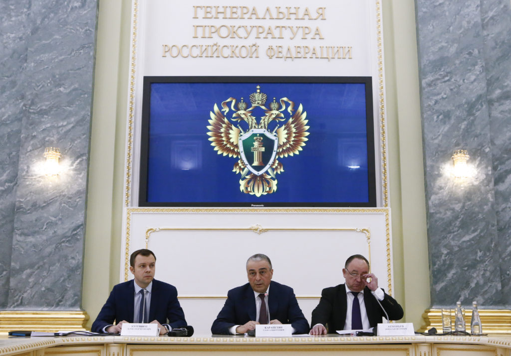 Russia's Deputy Prosecutor General Saak Karapetyan (C), spokesman for the Prosecutor General's Office Alexander Kurennoi (...