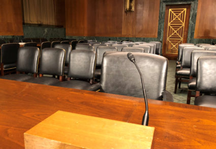 The witness table in the U.S. Senate Judiciary Committee hearing room where Dr. Christine Blasey Ford and U.S. Supreme Court nominee Judge Brett Kavanaugh will testify is seen on Capitol Hill in Washington, U.S., September 26, 2018. REUTERS/Jim Bourg -