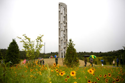 Family members and dignitaries attend the Sept. 9 dedication of the Tower of Voices for Flight 93 at the memorial in Shanksville, Pennsylvania. Photo by Jeff Swensen/Getty Images