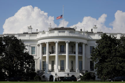 U.S. flag is seen at half-mast at the White House, as President Donald Trump's motorcade arrives from Trump National Golf Club, Washington, U.S., September 1, 2018. REUTERS/Yuri Gripas - RC18C90A74E0