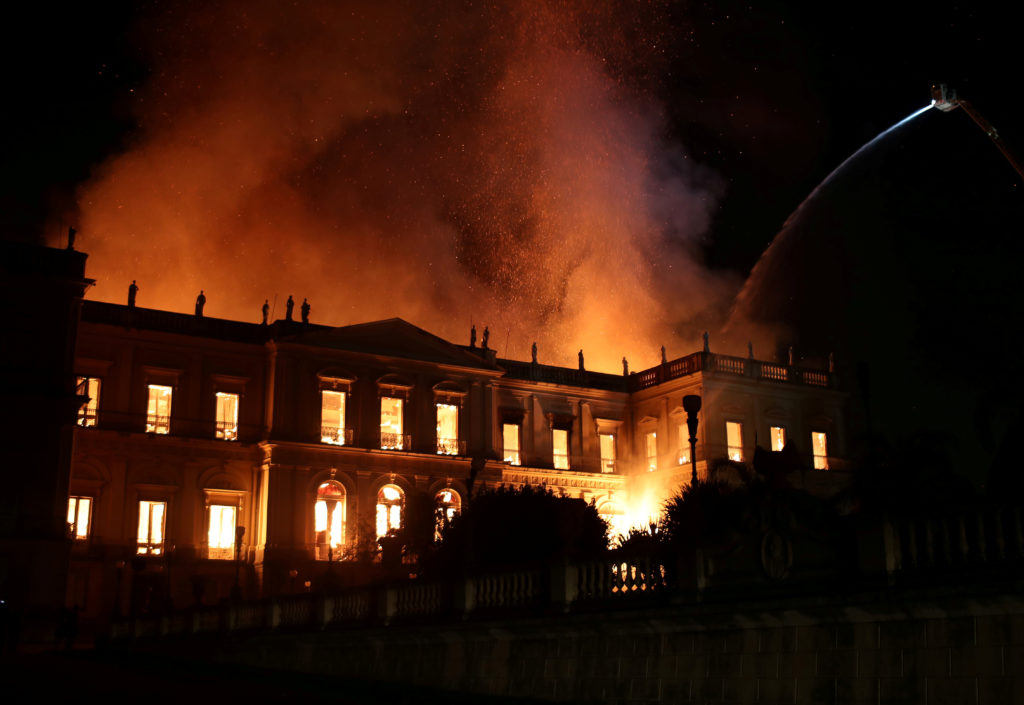 Firefighters work to douse flames at the National Museum of Brazil in Rio de Janeiro on Sept. 2. Photo by Ricardo Moraes/R...