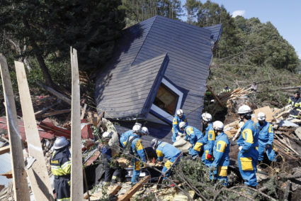 Rescue workers search for survivors from a house damaged by a landslide caused by an earthquake in Atsuma town, Hokkaido, Japan on Sept. 6. Photo by Kyodo/via Reuters