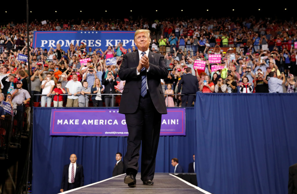 President Donald Trump greets the crowd as he arrives for a "Make America Great Again" rally in Billings, Montana. Photo b...