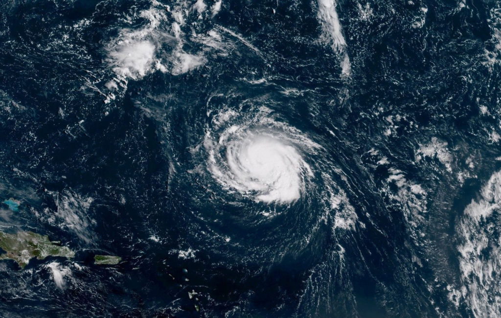Hurricane Florence seen over the Atlantic Ocean, about 750 miles southeast of Bermuda in this handout photo provided by th...