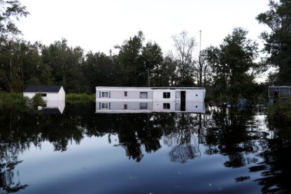 A mobile home is surrounded by flood waters in the aftermath of Hurricane Florence in Fair Bluff, North Carolina. Photo by Randall Hill/Reuters