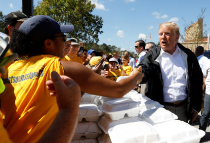 President Donald Trump greets people while distributing food after Hurricane Florence in New Bern, North Carolina, on Sept. 19. Photo by Kevin Lamarque/Reuters