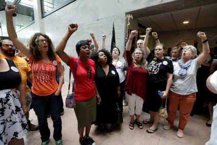 Protesters voice their opposition to U.S. President Donald Trump's Supreme Court nominee Brett Kavanaugh and their support for Dr. Christine Blasey Ford, the woman who has accused Kavanaugh of sexual assault, during a demonstration on Capitol Hill in Washington, D.C. Photo by Yuri Gripas/Reuters