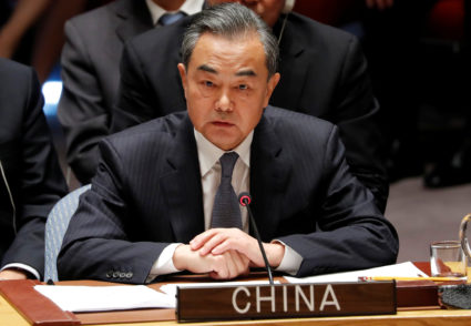 China's Foreign Minister Wang Yi listens to U.S. President Donald Trump address a UN Security Council meeting during the 73rd session of the United Nations General Assembly at U.N. headquarters in New York. Photo by Carlos Barria/Reuters