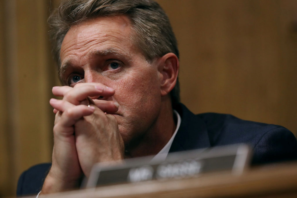 Senate Judiciary Committee member Sen. Jeff Flake (R-Ariz.) listens to testimony from Christine Blasey Ford in the Dirksen...