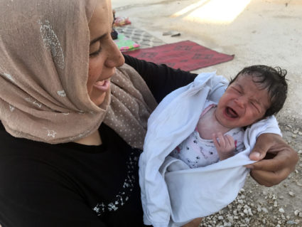Batoul's baby girl was 13 days old when the NewsHour team first met her in 2017. Photo by Kamiran Sadoun