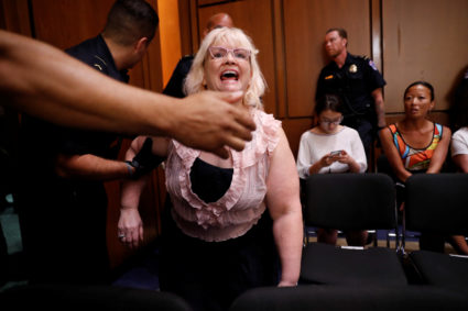 A protester disrupts a Senate Judiciary Committee confirmation hearing for U.S. Supreme Court nominee judge Brett Kavanaugh on Capitol Hill in Washington, U.S., September 4, 2018. REUTERS/Joshua Roberts