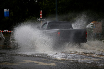 A man drives his vehicle around the Union Point Park Complex through floodwaters as the Hurricane Florence comes ashore in New Bern, North Carolina, U.S., September 13, 2018. Photo by REUTERS/Eduardo Munoz