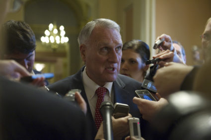 Sen. Jon Kyl (R-AZ) speaks to reporters after leaving the Mansfield Room following a caucus meeting at the U.S. Capitol in Washington December 30, 2012. Efforts to prevent the U.S. economy from tumbling over a "fiscal cliff" stalled on Sunday as Democrats and Republicans remained at loggerheads over a deal that would prevent taxes for all Americans from rising on New Year's Day. REUTERS/Mary Calvert