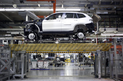 A Bayerische Motoren Werke AG (BMW) sports utility vehicle (SUV) sits on a platform during assembly at the BMW Manufacturing Co. plant in Greer, South Carolina, U.S. on Thursday, May 10, 2018. Markit is scheduled to release manufacturing figures on May 23. Photographer: Luke Sharrett/Bloomberg via Getty Images