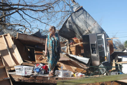 Kathy Coy stands among what is left of her home in Panama City, Florida following Hurricane Michael. Photo by Joe Raedle/Getty Images
