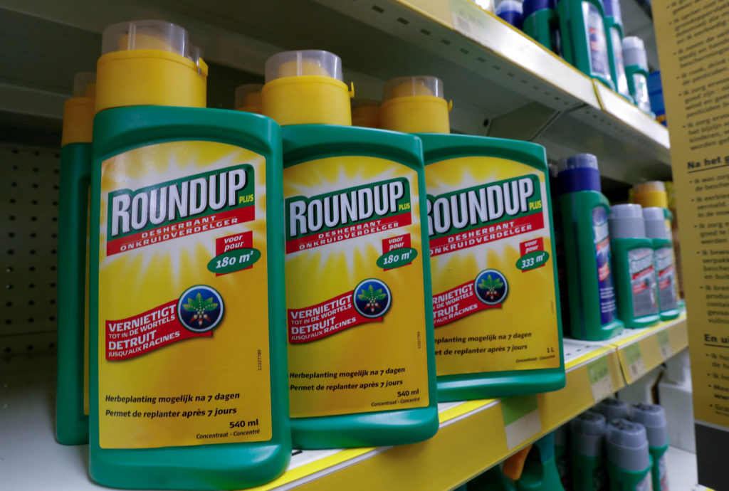 Monsanto's Roundup weedkiller atomizers are displayed for sale at a garden shop near Brussels, Belgium. Photo by Yves Herm...