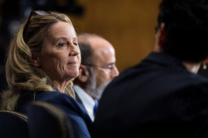 Christine Blasey Ford, center, flanked by attorneys Debra Katz and Michael Bromwich, testifies during the Senate Judiciary Committee hearing on the nomination of Brett M. Kavanaugh to be an associate justice of the Supreme Court on Sept. 27, 2018. Photo by Tom Williams/Pool via Reuters