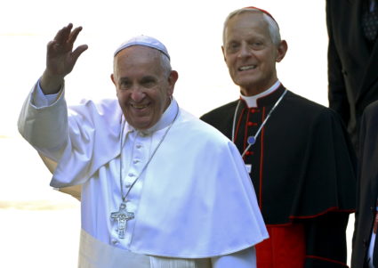Pope Francis (L) waves as he arrives with the Archbishop of Washington Cardinal Donald Wuerl for a prayer service and meeting with U.S. bishops at the Cathedral of St. Matthew the Apostle, in Washington, in September 2015. Photo by Mike Theiler/Reuters
