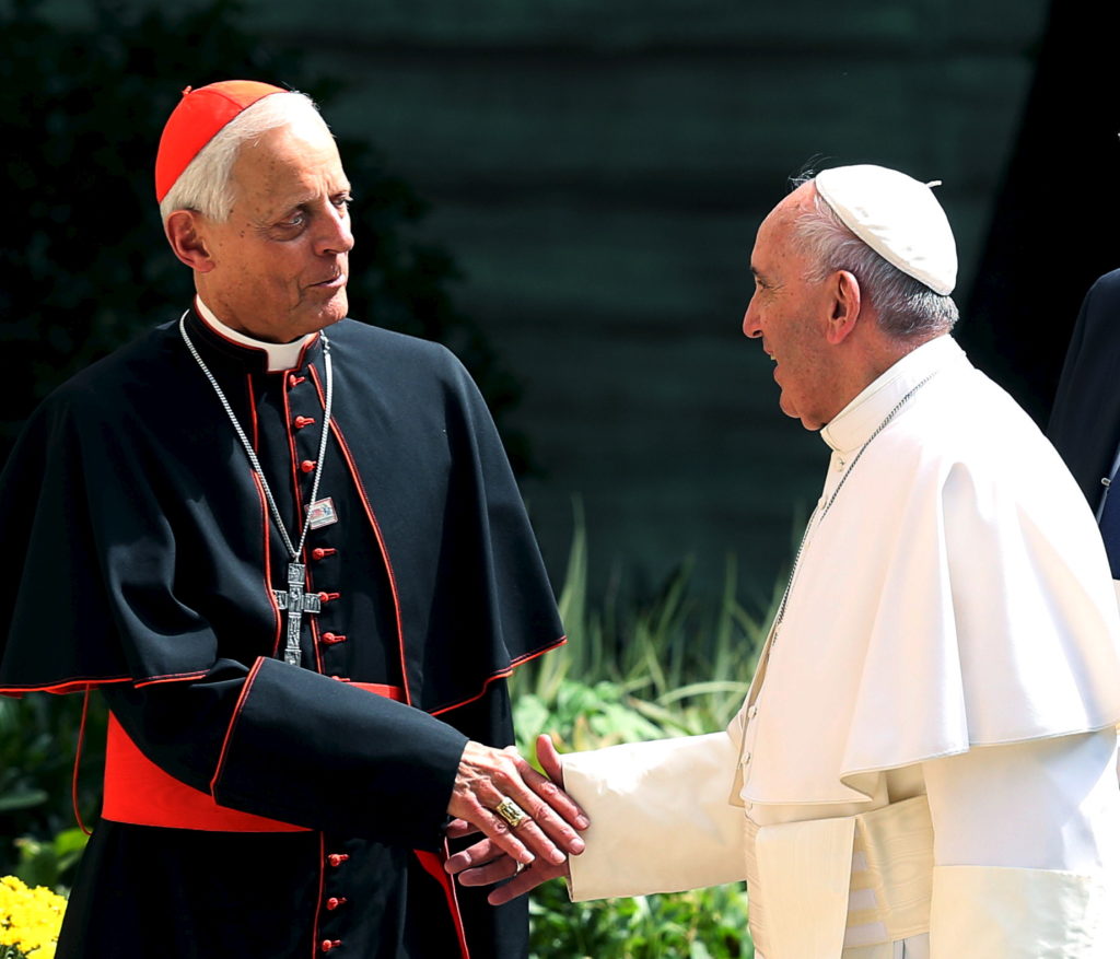 Pope Francis greets the Archbishop of Washington, Cardinal Donald Wuerl, upon returning to the Vatican Embassy in Washingt...