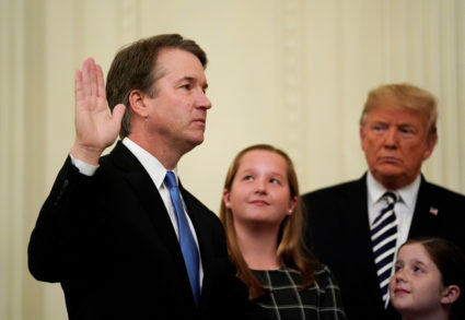 Supreme Court Associate Justice Brett Kavanaugh participates in his ceremonial public swearing-in as he is watched by daughters Liza and Margaret and U.S. President Donald Trump in the East Room of the White House in Washington, D.C. Photo by Jonathan Ernst/Reuters