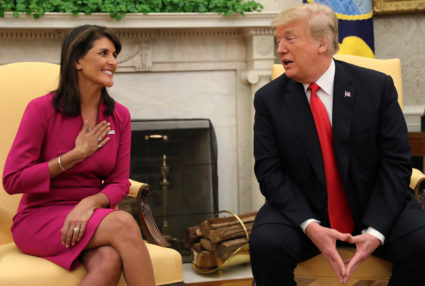 U.N. Ambassador Nikki Haley listens to U.S. President Donald Trump in the Oval Office of the White House after it was announced the president had accepted the Haley's resignation in Washington, D.C. Photo by Jonathan Ernst/Reuters