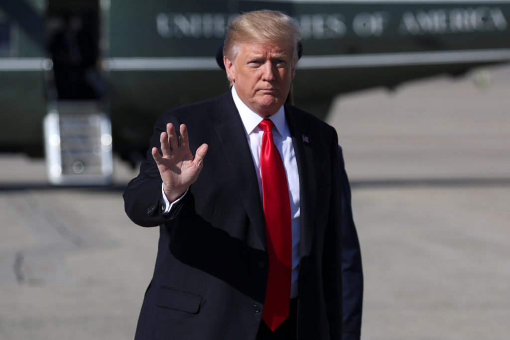 U.S. President Donald Trump waves prior to departing on travel to Ohio from Joint Base Andrews, Maryland. Trump has not ap...