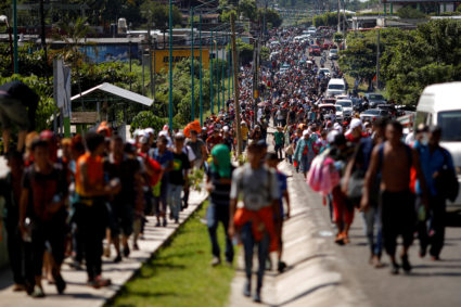 Central American migrants walk along a highway in Mexico near the border with Guatemala on their way to the U.S. on Oct. 21. Photo by Ueslei Marcelino/Reuters