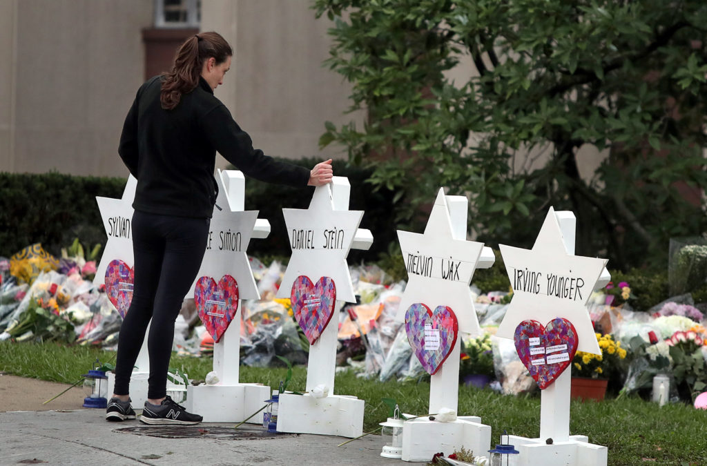 A woman reacts at a makeshift memorial outside the Tree of Life synagogue following Saturday's shooting at the synagogue in Pittsburgh, Pennsylvania. Photo by Cathal McNaughton/Reuters