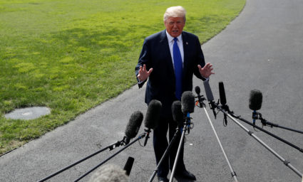 U.S. President Donald Trump talks to reporters on his way to the Marine One helicopter on the South Lawn as he departs for travel to Pennsylvania and Tennessee from the White House in Washington, U.S. October 2, 2018. REUTERS/Leah Millis - RC18933BBDE0