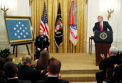 U.S. President Donald Trump awards former U.S. Army medic Ronald J. Shurer the Medal of Honor "for conspicuous gallantry" for actions Shurer took while serving in 2008 in Afghanistan at the White House in Washington, U.S., October 1, 2018. REUTERS/Leah Millis