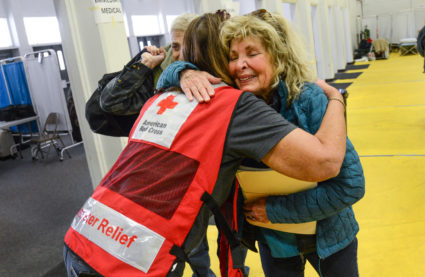 Joy and tears as Diane Papedo finds her brother, Phil Mazores and are reunited at the at the Butte County Fairground Red Cross shelter. Photo by Daniel Cima/American Red Cross