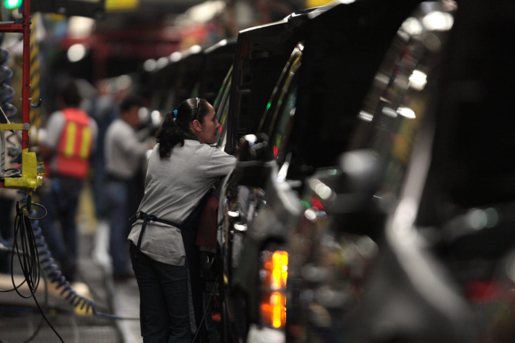Factory employees are seen working in the plant of General Motors in the city of Silao, in the state of Guanajuato, Mexico...