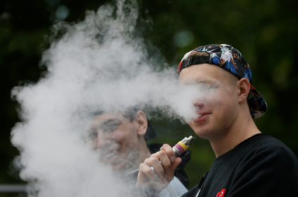 File photo of man with electronic cigarette by Valentyn Ogirenko/Reuters