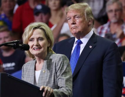 Sen. Cindy Hyde-Smith, R-Miss., joins President Donald Trump onstage at a campaign rally in Southaven, Mississippi, on Oct. 2, 2018. Photo by Jonathan Ernst/Reuters