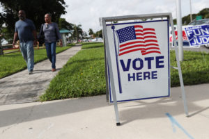 A voting sign is seen outside polling station in Riviera Beach, Florida, U.S., November 4, 2018. Photo by REUTERS/Shannon Stapleton