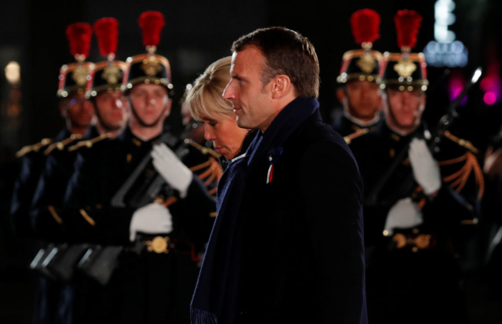 French President Emmanuel Macron and his wife Brigitte arrive to attend a concert to mark the 100th anniversary of the end...