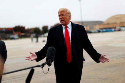 President Donald Trump talks to reporters prior to departing Washington on a campaign trip from Joint Base Andrews in Maryland. Photo by Reuters