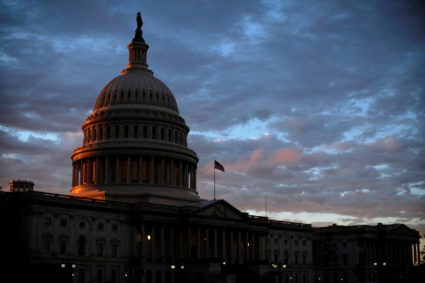 The sun sets behind the U.S. Capitol dome in Washington, U.S., on midterm election day, November 6, 2018. Photo by REUTERS/James Lawler Duggan