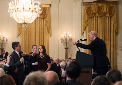 A White House staff member reaches for the microphone held by CNN's Jim Acosta as he questions President Donald Trump during a news conference following Tuesday's midterm congressional elections at the White House in Washington, D.C. Photo by Jonathan Ernst/Reuters