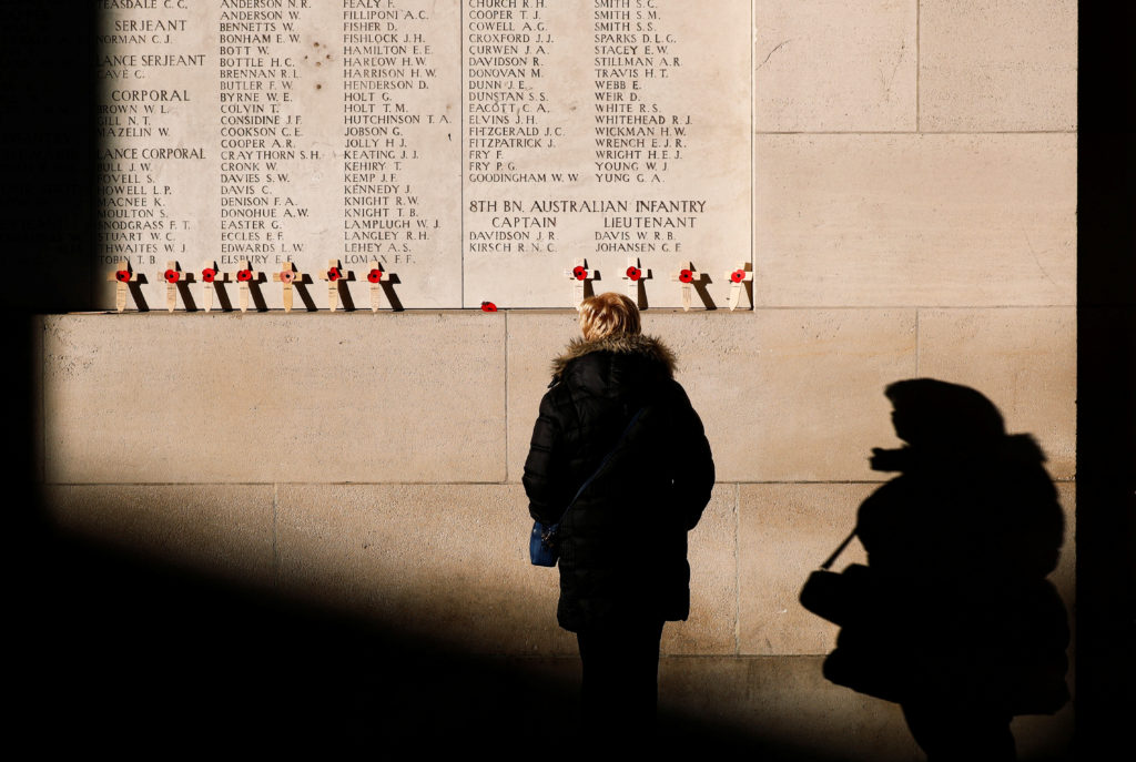A visitor looks at engraved names of British and Commonwealth soldiers who died in World War One at the Menin Gate Memoria...